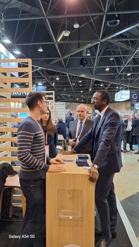 Visitors talking in an exhibition hall during the first day of EUROMARITIME in Marseille.